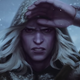 Drizzt Do'Urden raises a hand to his hooded head to protect his vision in a snowstorm.